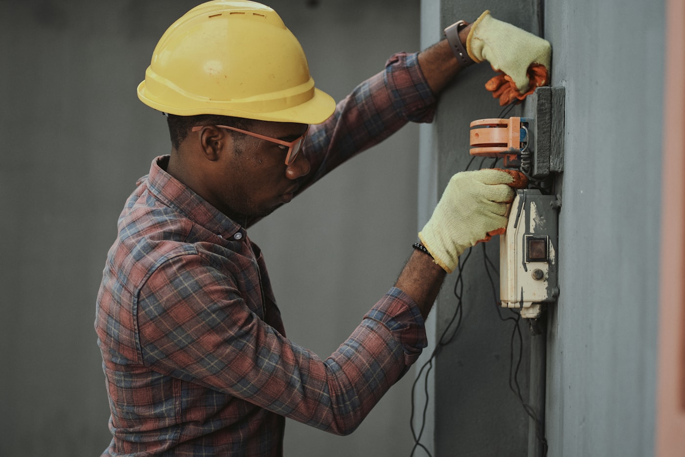 UM Plumbing technician working on a water heater installation